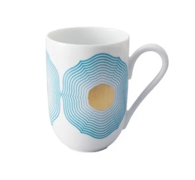 The Aura Dinnerware mug by Raynaud is a white ceramic piece with a handle, showcasing a modern design of concentric blue circles with a yellow center, crafted in France.