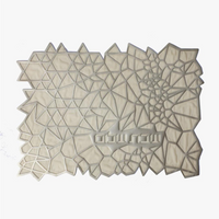 The Apeloig Geometric Challah Cover is a rectangular, laser-cut piece with an abstract pattern of white and light gray polygons and triangles, shown on a plain white background.