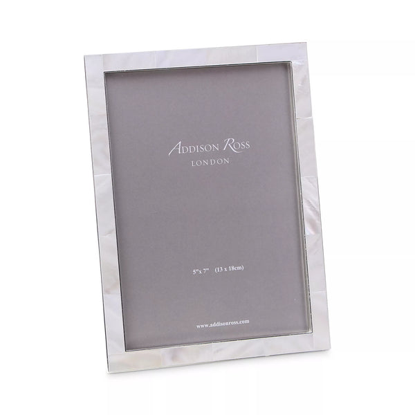 The Addison Ross Mother of Pearl Frame features a sleek rectangular design with a lustrous shell border, shown angled with a grey insert marked for 5x7 (13x18cm) photos—an elegant gift from Addison Ross.
