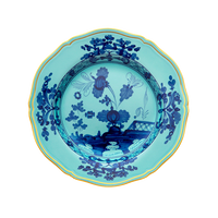 The Ginori 1735 Oriente Italiano Dinnerware Iris plate features a blue and white chinoiserie floral motif with a gold rim on a white background.