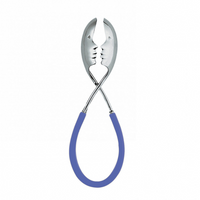 The Casa Bugatti KISS Salad Tong features two metal tongs with face cutouts and blue rubber handles crossed to look like faces about to kiss—a playful accessory perfect for summer entertaining.