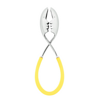 The Casa Bugatti KISS Salad Tong pairs two metal spoons with yellow handles, their heads forming face profiles about to kiss—a unique and stylish accessory for summer entertaining.