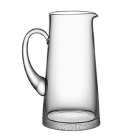 The Orrefors Kosta Boda Limelight Jug features crystal glass, a wide base, rounded handle, and narrow spout, shown against a plain white background.