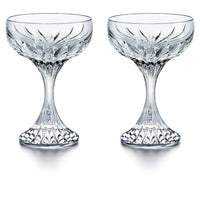 The Baccarat Masséna Coupe Set of 2 features elegant crystal glass coupe glasses with intricate faceted patterns—an exquisite addition to any barware collection.
