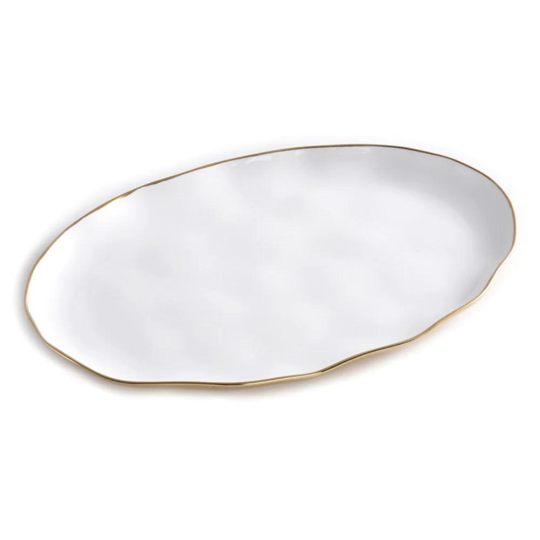 The Moonlight Oval Tray by PAMPA BAY is a white porcelain platter with an uneven wavy edge and a slim gold titanium rim, shown on a plain white background.