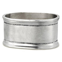 The MATCH Oval Napkin Ring Set of Two features a subtly oval shape with a brushed silver finish and two engraved lines, handcrafted in the signature MATCH style.