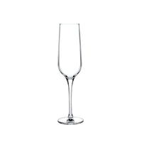 Centered against a white background, the Nude Glassware Refine Glassware Set of 2 features clear, lead-free crystal champagne flutes with long stems and narrow bowls, highlighting the elegance of fine glassware.