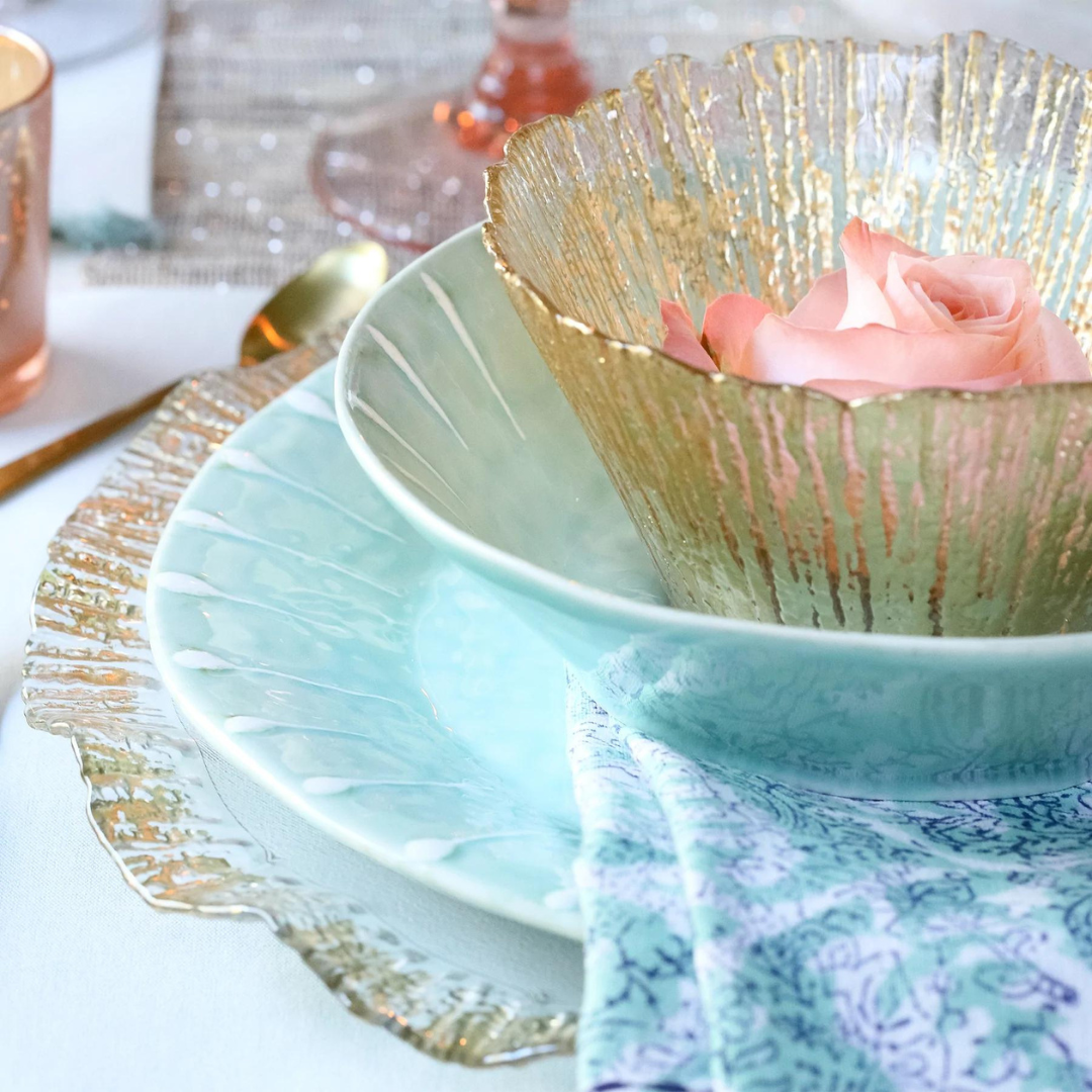 The rufolo dinnerware is designed with gold textured strands. 