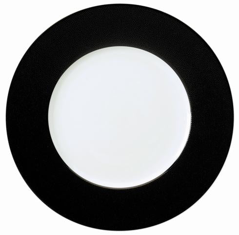 The Philippe Deshoulieres Seychelles Black Charger 12.6" is a round white porcelain plate with a wide, textured black rim, shown from above on a plain background.
