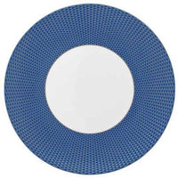 The Raynaud Tresor Dinnerware Blue round plate features a textured blue rim and smooth white center—ideal for formal, elegant settings and viewed from above.