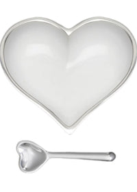 The Inspired Generations Happy Heart Snack Bowl & Spoon features a white, heart-shaped dish and matching spoon with shiny silver accents—perfect for showcasing your Happy Hearts Bowls collection.